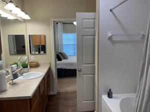 One Bedroom Apartments in San Antonio, TX - Model Bathroom with View to Bedroom