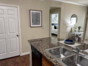 Two Bedroom Apartments in San Antonio, Texas - Model Apartment View from Kitchen to Bedroom and Living Room