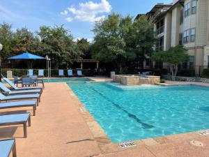 Apartments in San Antonio, TX - Swimming-Pool-and-Patio-Area-with-Lounge-Chairs